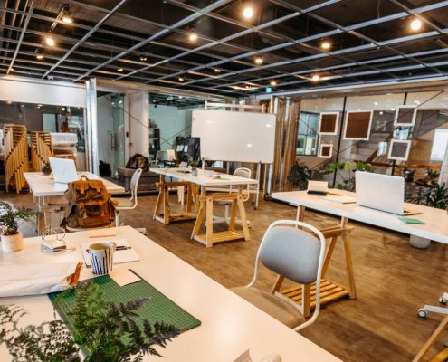 urban office space with wood paneling and greenery