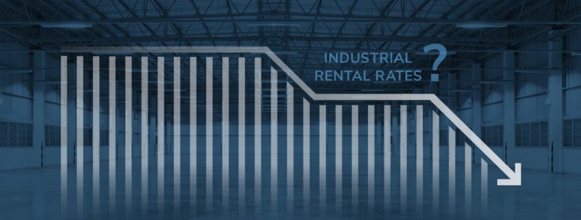 vacant industrial warehouse with downward trend rental rate graph overlay