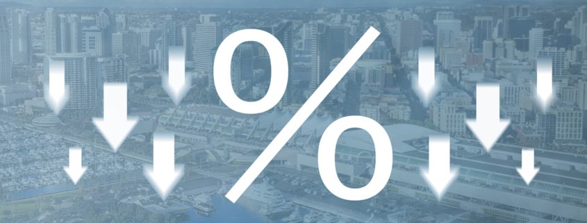 percent symbol surrounded by down arrows on a faded blue background of the San Diego skyline