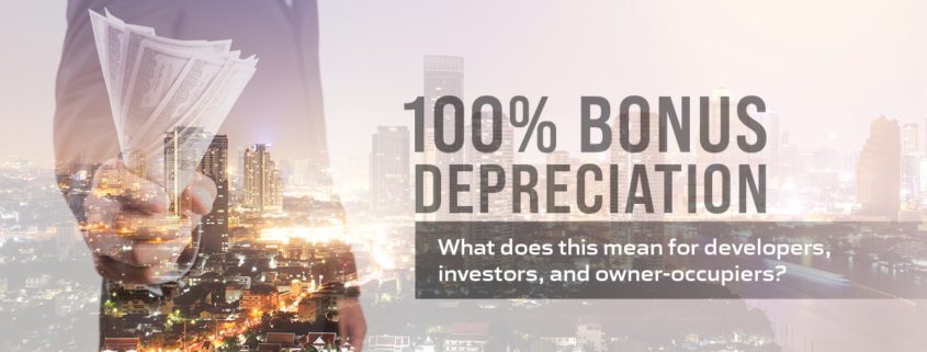 100 percent bonus depreciation text on image of man holding cash superimposed on city skyline
