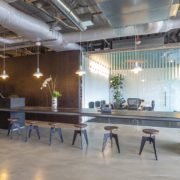 empty high end office space with reception area long shared desk and conference room