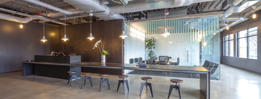 empty high end office space with reception area long shared desk and conference room