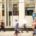 Blurred people walking past a retail department store
