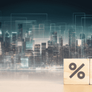 Percentage rate with down arrow over skyline of commercial buildings