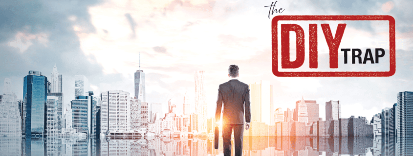 Businessman standing facing a city skyline with a DIY trap stamp overlay