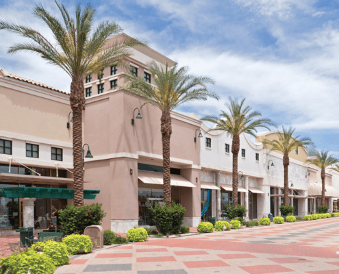 empty outdoor retail shopping center with beautiful palm trees