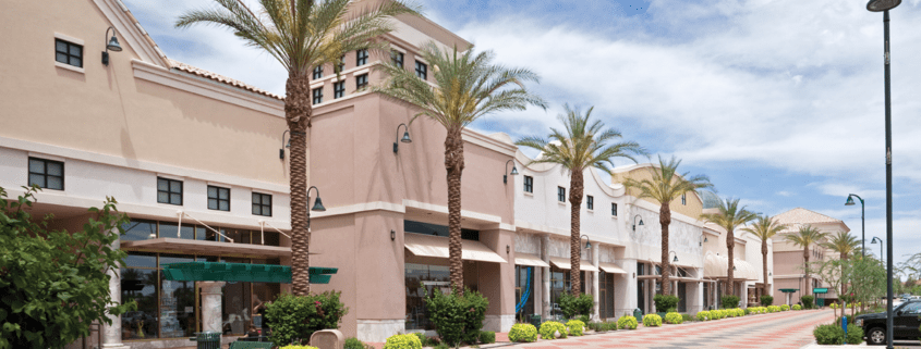 empty outdoor retail shopping center with beautiful palm trees