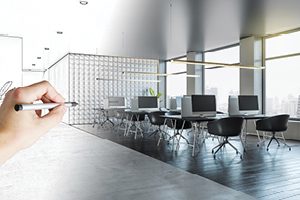 An architectural sketch of an office space transitioning into the completed fully furnished space
