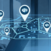 A map with several property locations marked overlayed on an image of a woman working on a laptop