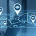 A map with several property locations marked overlayed on an image of a woman working on a laptop