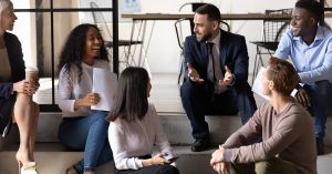 Casual group discussion between boss and employees - strong company culture