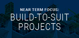 Near term focus build-to-suit projects text on construction site