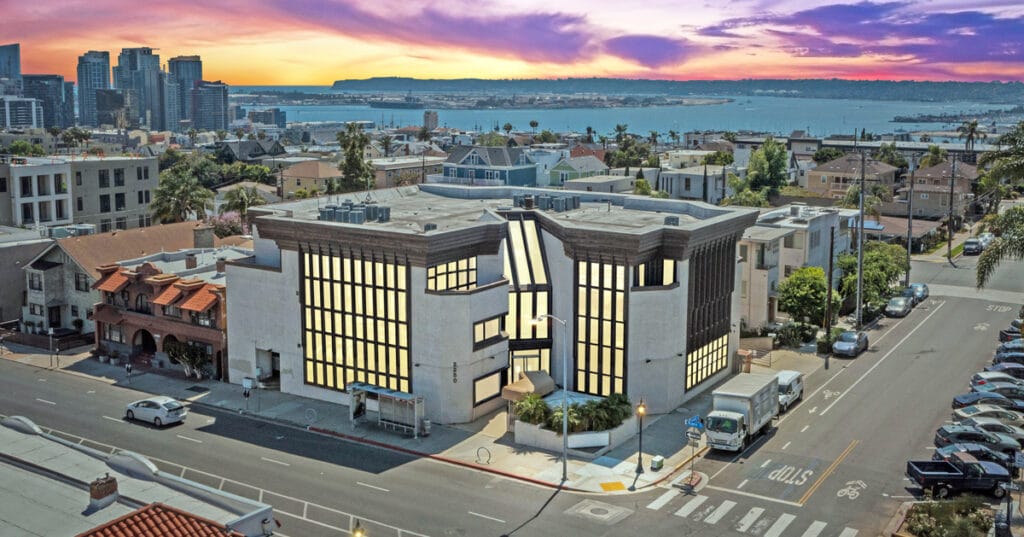 Aerial view of 2250 Fourth Avenue at sunset with the ocean in the background