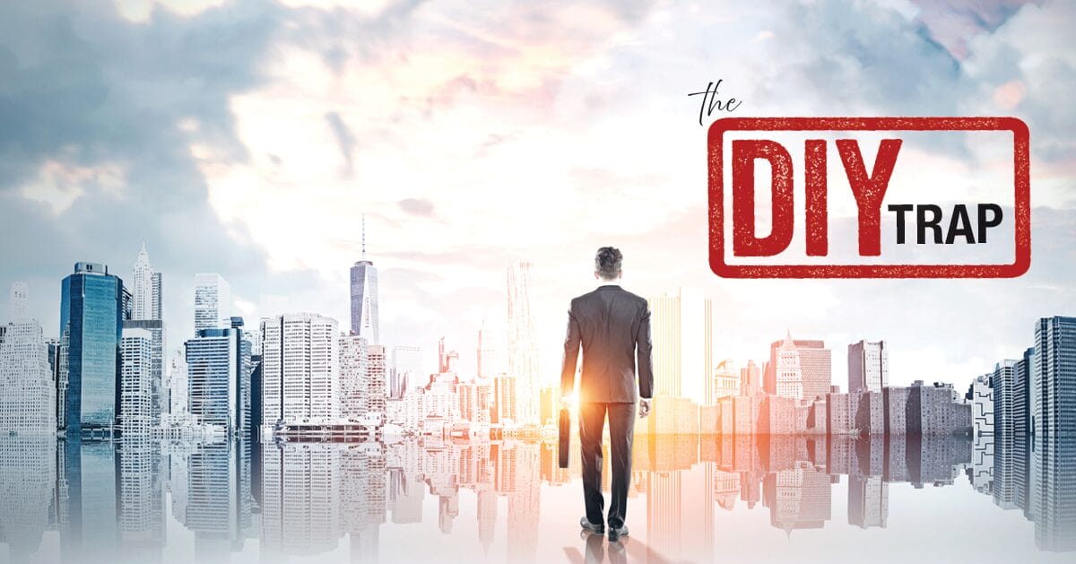 Businessman standing facing a city skyline with a DIY trap stamp overlay