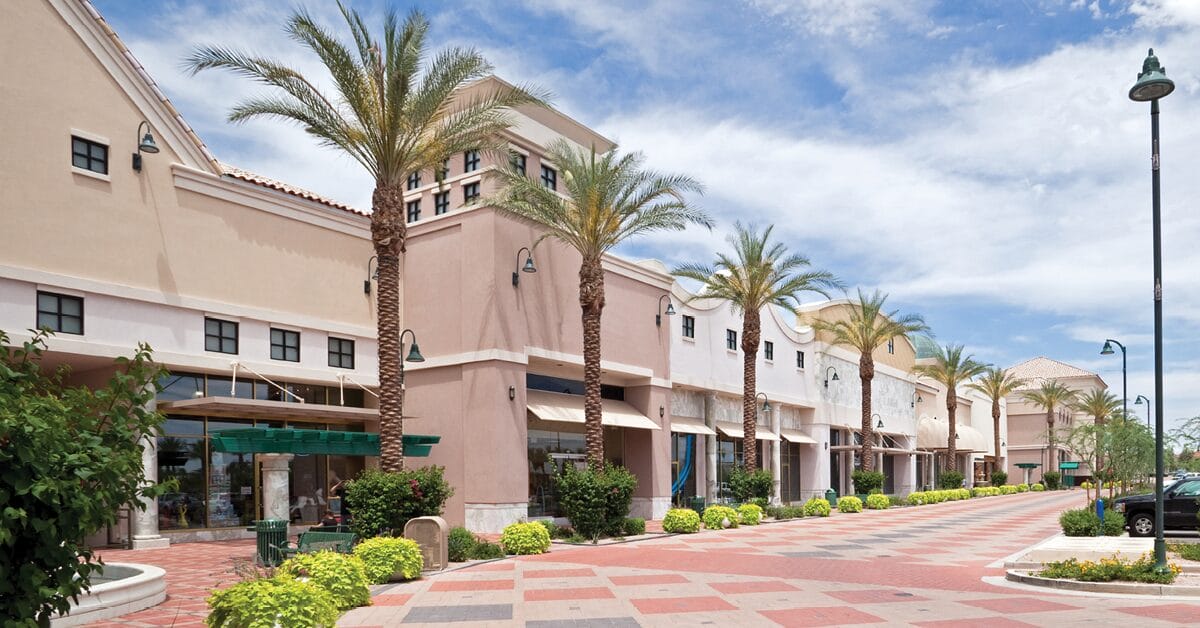 empty outdoor retail shopping center with beautiful palm trees