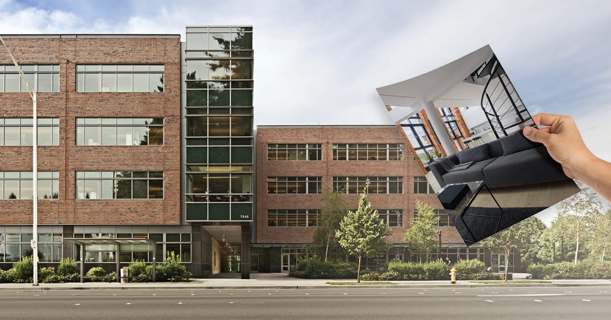 hand holding an apartment rendering over an office building pending conversion to multifamily housing